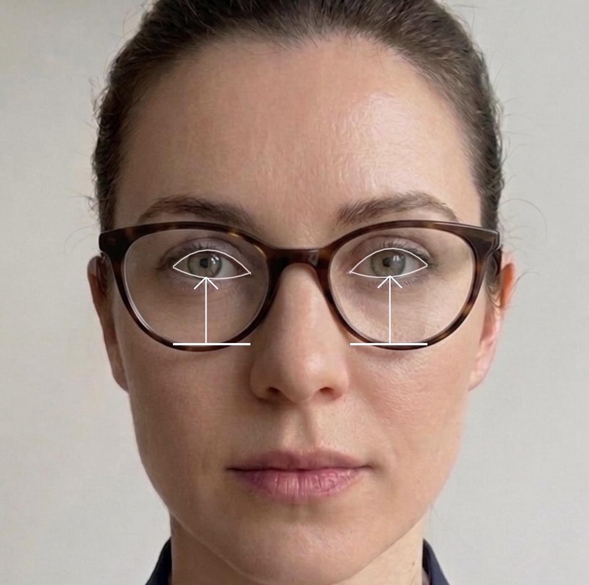 Woman wearing glasses with fitting height measurement overlays